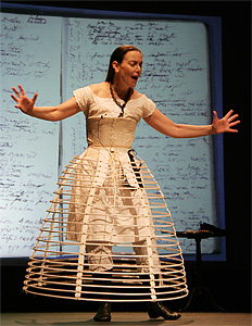 Barbara Neri onstage dressed in hoops